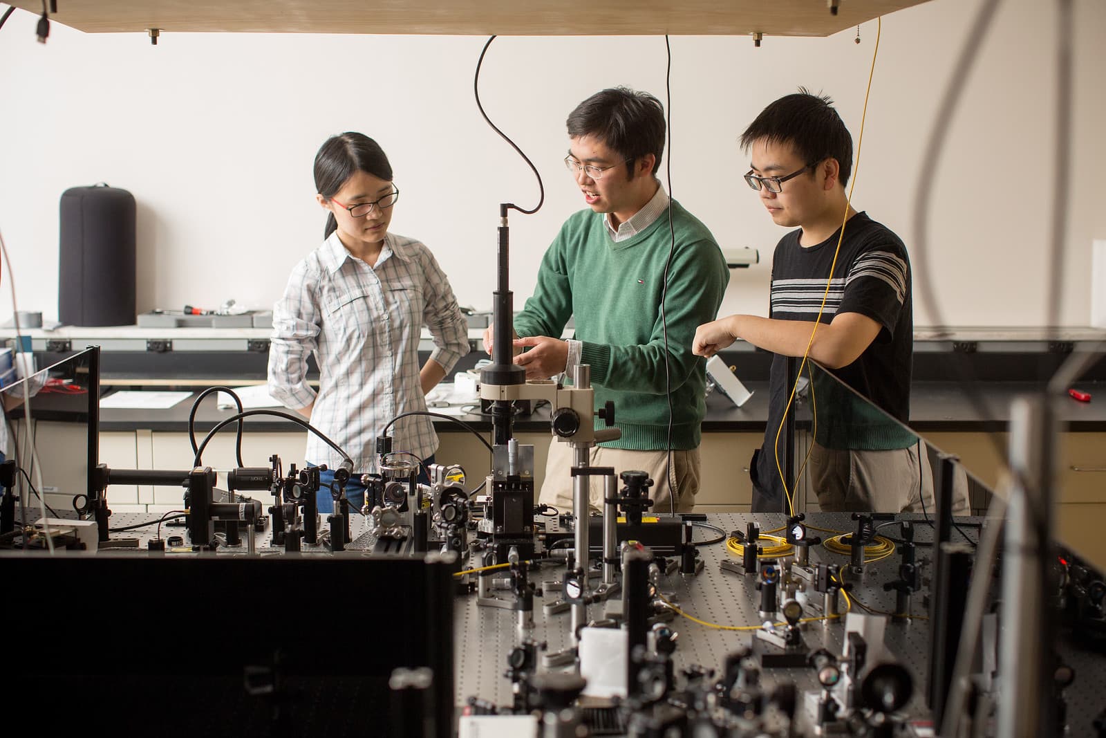 Xu Lab team working with optical equipment